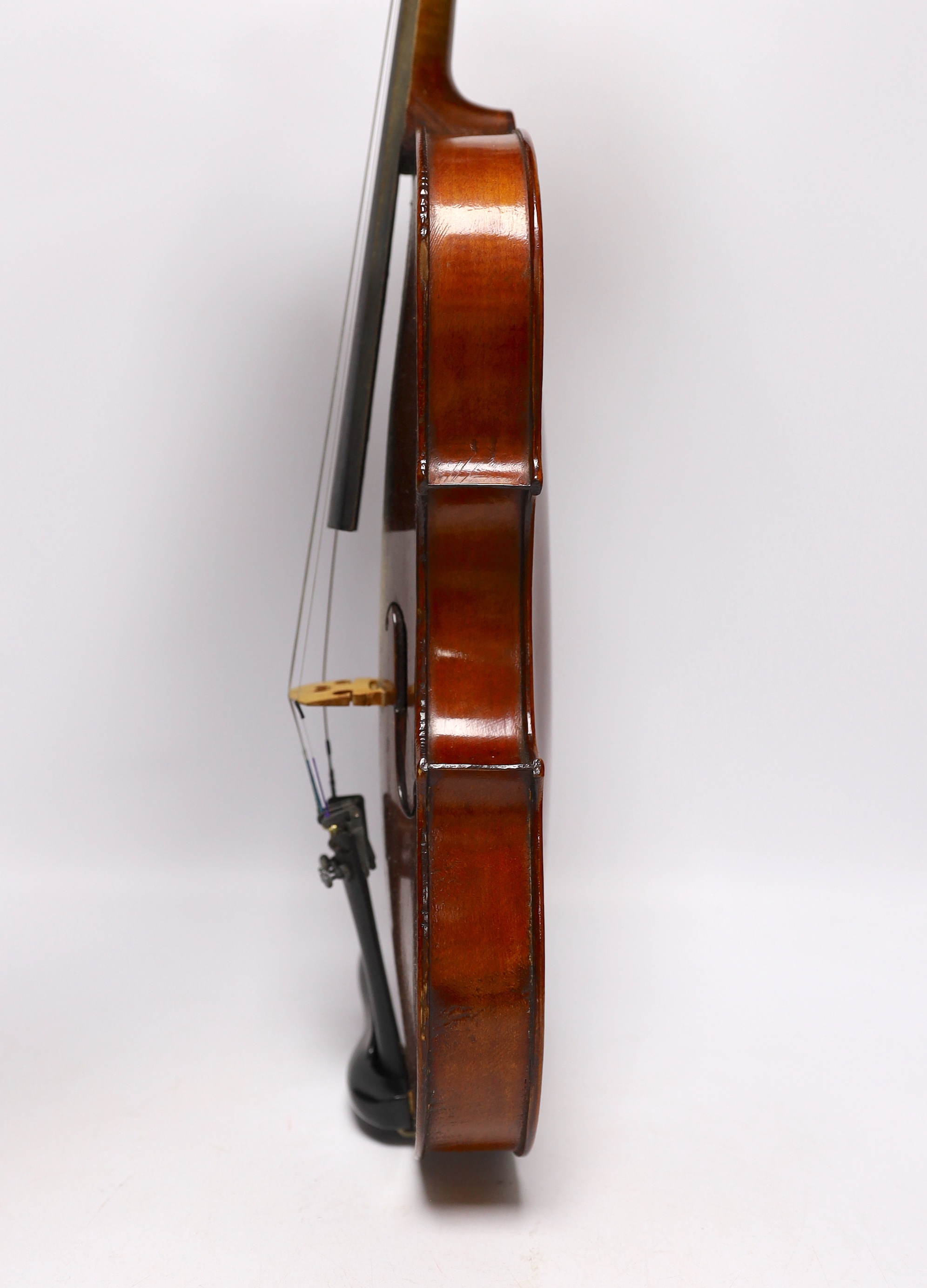 A wooden cased student violin
